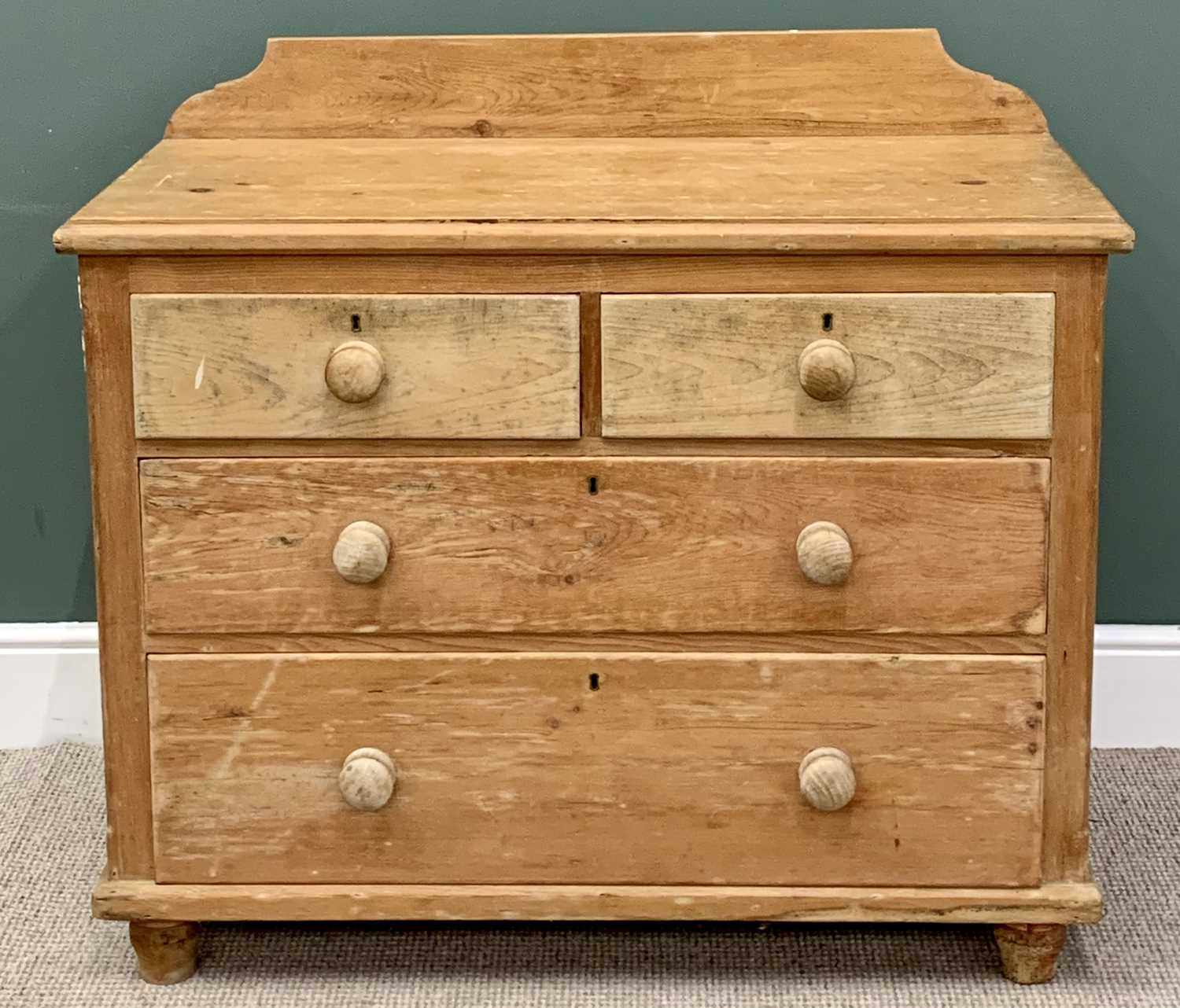 VICTORIAN STRIPPED PINE RAILBACK CHEST - of two short and two long drawers with turned wooden
