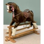 ROCKING HORSE - a modern Mamas & Papas example, on a light wood trestle base, 107cms H, 128cms W,