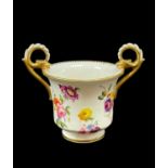 NANTGARW PORCELAIN CABINET CUP circa 1818-1820, footed and bell shaped, having twin gryphon handles,