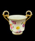 NANTGARW PORCELAIN CABINET CUP circa 1818-1820, footed and bell shaped, having twin gryphon handles,