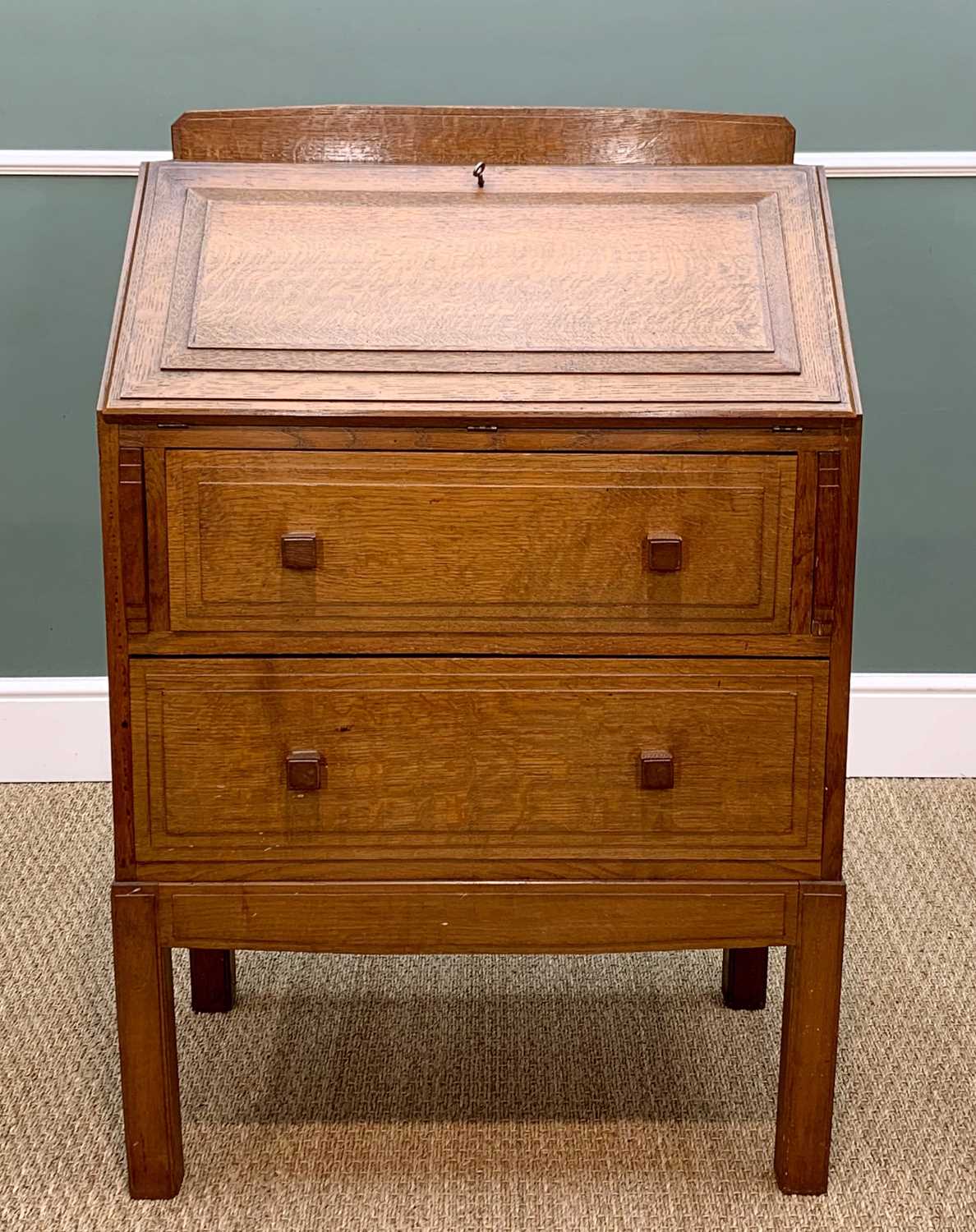 PAUL MATT FOR BRYNMAWR: OAK BUREAU, 1930s, stage back above step moulded angled fall and sides,