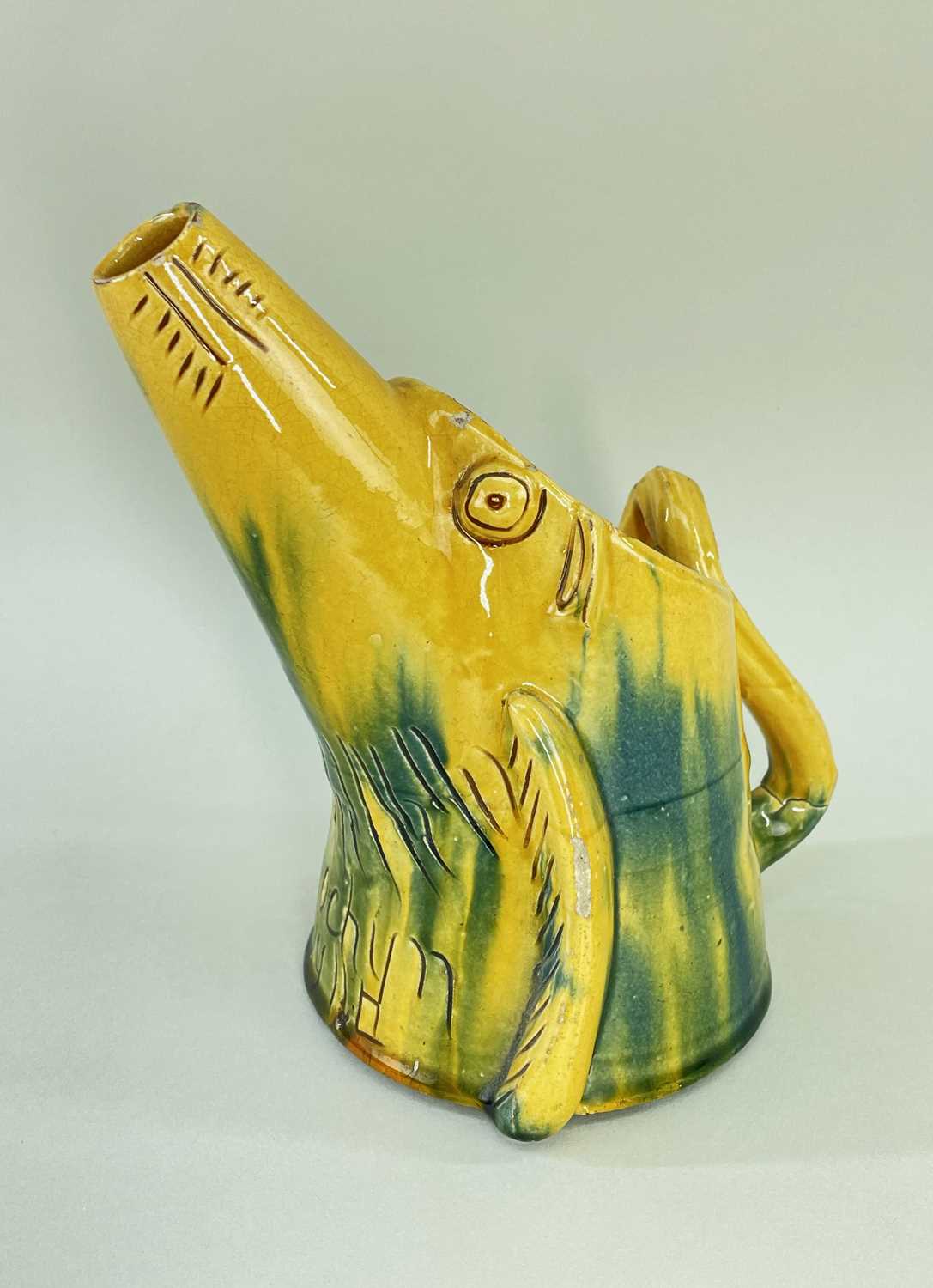 EWENNY SLIPWARE POTTERY ZOOMORPHIC JUG in the form of a pig with elongated mouth to form spout, in