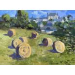 ‡ GWILYM PRICHARD oil on canvas - field with baled hay, river, bridge and town in background,