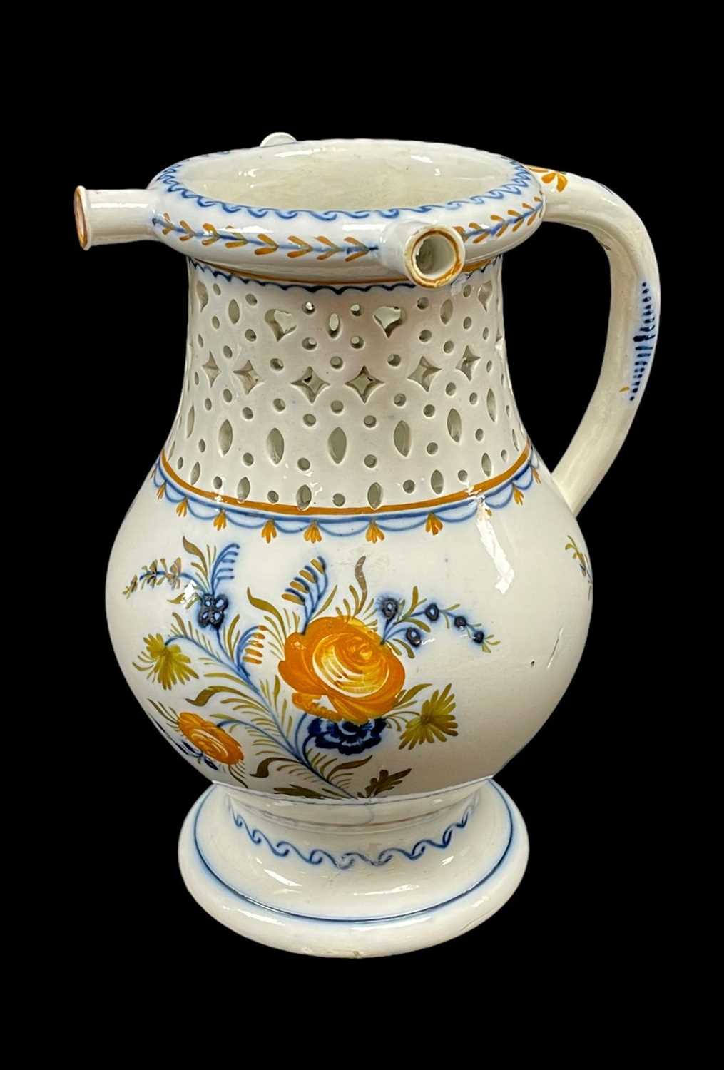 RARE SWANSEA PEARLWARE PUZZLE JUG circa 1800, footed baluster form, pierce-work neck, tubular handle