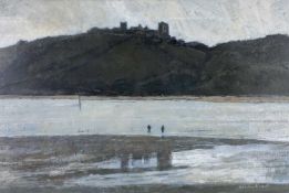 ‡ GORDON STUART oil on card - two figures on the shoreline with Llansteffan Castle on hill behind,