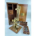 BAKER OF LONDON BINOCULAR MICROSCOPE, the gilt brass microscope marked 'Baker 244 High Holborn