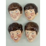 FULL SET FOUR BEATLES KELSBORO WARE WALL MASKS, c. 1964, no. 1 Ringo Star, no. 2 George Harrison,