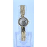 LADIES 14K GOLD OMEGA WRISTWATCH, the dial having baton hour markers, engraved 'Kristina 30.5.64',