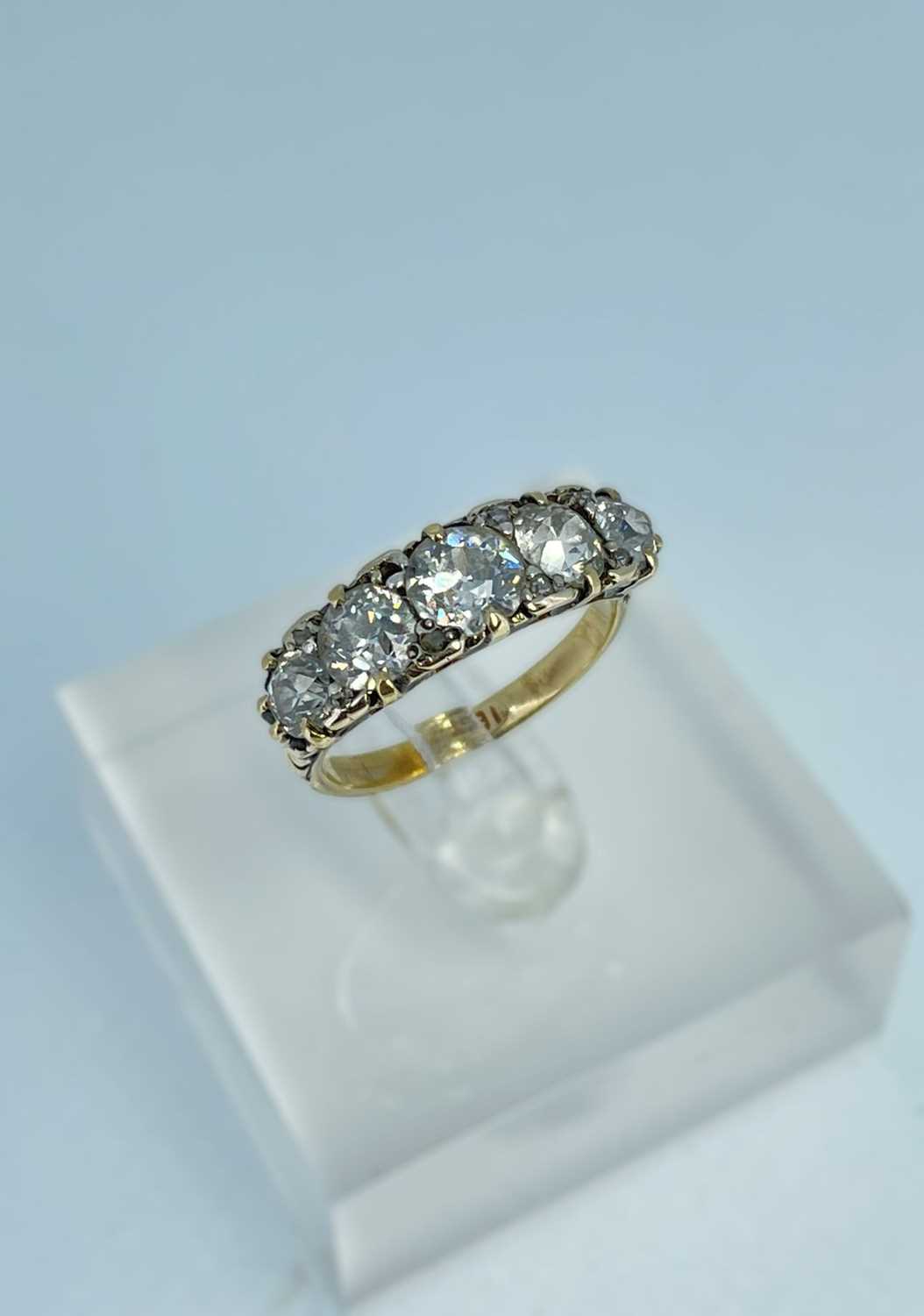 18CT GOLD FIVE-STONE DIAMOND RING, the five pavé set old European cut stones measuring 1.4cts