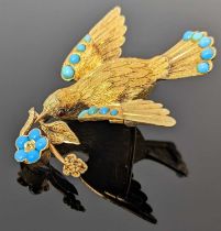 19TH CENTURY GOLD DOVE BROOCH, the dove holding a sprig in its beak, set with turquoise and cabochon