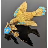 19TH CENTURY GOLD DOVE BROOCH, the dove holding a sprig in its beak, set with turquoise and cabochon