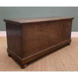 ANTIQUE ELM COFFER, of plain boarded construction, moulded hinged top and moulded base raised on bun