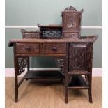 CHINESE CARVED HARDWOOD WRITING DESK, c. 1900, asymmetric form with carved simulated bamboo frame,