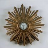 FRENCH GILTWOOD 'SUNBURST' WALL TIMEPIECE, central 3 1/2in. white enamel dial with Arabic