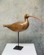 JUDITH NICOLL (Contemporary) carved wood - Curlew, raised on stand, the underside with hand