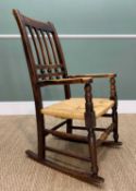 SMALL EARLY 20TH CENTURY STAINED BEECH ROCKING CHAIR, with bar back and triple cross bar, woven rush