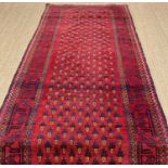 PERSIAN RUNNER, red and dark blue, with a field of repeated geometric vase pattern, 115 x