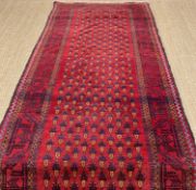 PERSIAN RUNNER, red and dark blue, with a field of repeated geometric vase pattern, 115 x