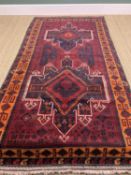 TURKISH RUG, burgundy, orange, and white, probably Yuruk, Anatolia, geometric star shaped