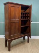 19TH CENTURY MAHOGANY CUPBOARD ON STAND, moulded cornice above panelled doors, raised on canted