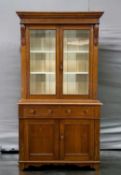 LATE 19TH C. OAK BOOKCASE CABINET, glazed doors enclosing painted interior, two frieze drawers,