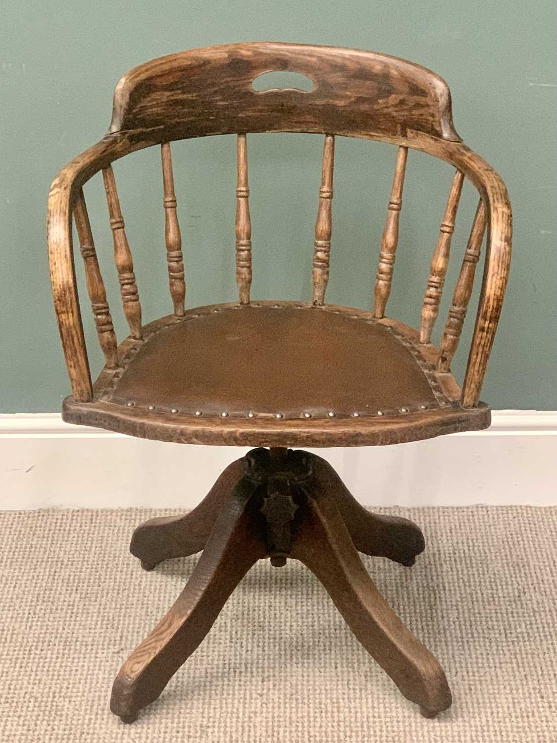 VICTORIAN OAK CURVED BACK OFFICE CHAIR - spindle uprights, rexine seat, on a swivel base and four