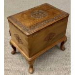 CAMPHORWOOD WORK BOX - on cabriole supports having a lift-up top, base drawer and carved detail,