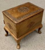 CAMPHORWOOD WORK BOX - on cabriole supports having a lift-up top, base drawer and carved detail,
