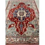 EASTERN WOOLLEN RUG - green and cream ground with red central motif, 298 x 200cms