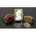 9CT GOLD RINGS (3) - one with deep rectangular setting on open shoulders set with a carved shell