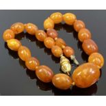 AMBER BEAD NECKLACE - with 18ct gold closer, 39cms overall L, 22 individually knotted beads, 25mm