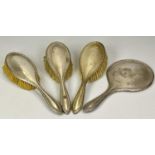 SILVER DRESSING TABLE HAND MIRROR & BRUSHES GROUP - 4 items to include a matching circular hand