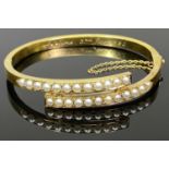 VICTORIAN, BELIEVED 15CT GOLD & SEED PEARL BANGLE - inscribed to the interior 'Adeline 3rd Jan