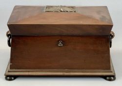 A REGENCY MAHOGANY SARCOPHAGUS FORM TEA CADDY with wing side handles, lift-up lid with plush lined