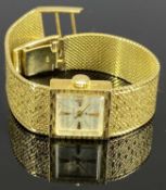 HAMILTON 18CT GOLD INTEGRAL BRACELET WRISTWATCH - square dial having baton indicators at the