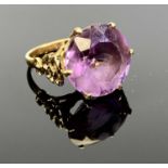 9CT GOLD AMETHYST RING - Birmingham date letter for 1971, 15mm diameter round cut amethyst, claw set