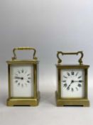 A GILDED BRASS CASED CARRIAGE CLOCK - white enamelled dial with black Roman numerals, eight day