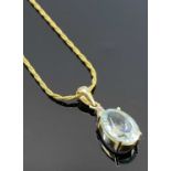 ITALIAN 14CT GOLD PENDANT NECKLACE - with 15 x 10mm oval, possibly aquamarine, below a grouped