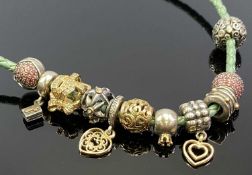 PANDORA NECKLACE with 14ct gold, silver and gold, diamond set and other beads, eleven in total on