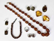 MODERN AMBER, AMBER TYPE JEWELLERY GROUP - 7 items to include a graduated oval bead necklace with