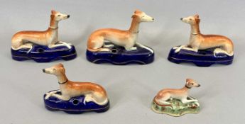 VICTORIAN STAFFORDSHIRE POTTERY INKWELLS - modelled as recumbent greyhounds on blue bases with