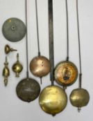 LONGCASE CLOCK PENDULUMS (5) - with lead filled bobs, a cast metal clock bell, 10.5cms diameter
