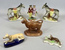 STAFFORDSHIRE PEARLWARE POTTERY GROUP - Dandies, circa 1820, the male wearing red jacket and