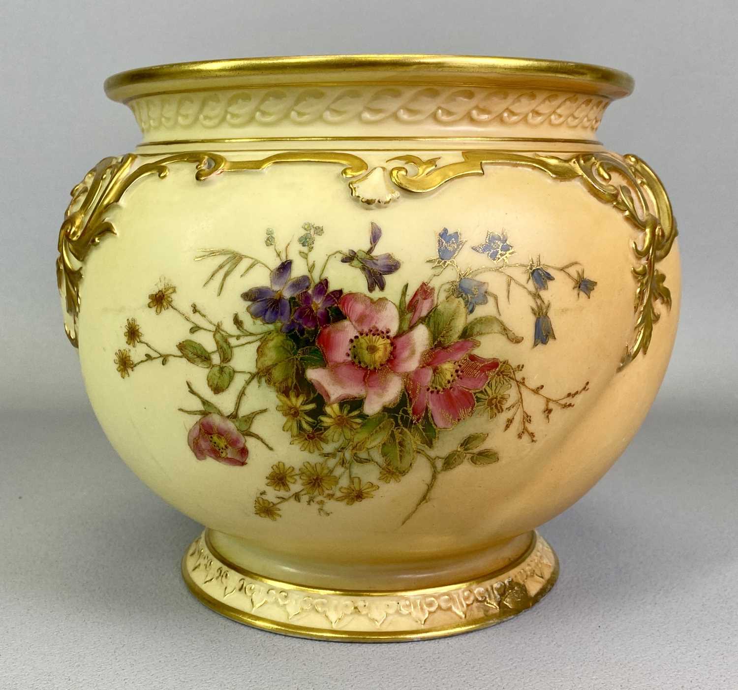 ROYAL WORCESTER 'BLUSH IVORY' JARDINIERE - hand painted with floral sprays and with gilt highlighted