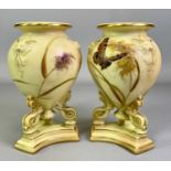 GRAINGER ROYAL CHINA WORKS WORCESTER BLUSH IVORY VASES, A PAIR - tri-footed and on plinths, each