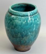LIZZY WOOD HARROGATE - a Raku vase of baluster form, glazed in turquoise and reds, impressed mark to