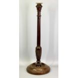 A TALL TURNED MAHOGANY CANDLESTICK - early 19th century, the column fluted and carved with