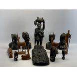 NATIVE ART INTEREST - a group of carved ebony busts, masks and figures, 47.5cms H the tallest with