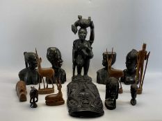 NATIVE ART INTEREST - a group of carved ebony busts, masks and figures, 47.5cms H the tallest with