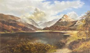 DOROTHEA HYDE oil on canvas - Dolbadarn Castle and surrounding scenery, signed, 50 x 83cms